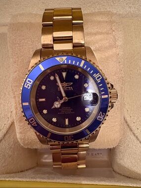 Gold Men’s Invicta Wristwatch with Blue Dial and Bezel